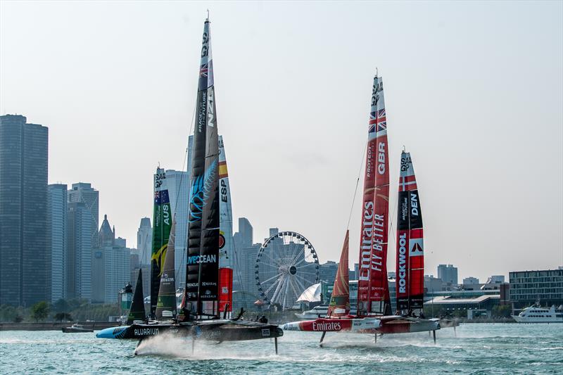 New Zealand SailGP Team, Emirates Great Britain SailGP Teame and the fleet sail toward the Centennial Wheel and the Chicago skyline on Race Day 1 of the Rolex United States Sail Grand Prix | Chicago at Navy Pier - photo © Ricardo Pinto for SailGP