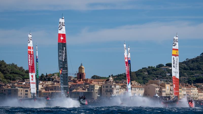 The fleet sail past the bell tower and old town of Saint Tropez on Race Day 1 of the Range Rover France Sail Grand Prix in Saint Tropez, France. 10th September 2022 - photo © Bob Martin for SailGP
