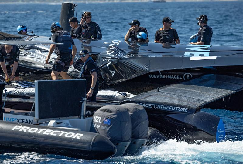 New Zealand SailGP Team view the damage to their F50 catamaran after Race 3 on Race Day 1 of the France Sail Grand Prix in Saint-Tropez, France photo copyright Felix Diemer/SailGP taken at  and featuring the F50 class
