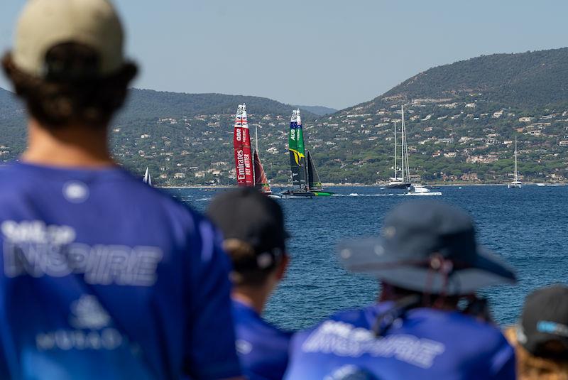 Young sailors take part in the Inspire Racing x WASZP program look on as Emirates Great Britain SailGP Team helmed by Ben Ainslie and Australia SailGP Team helmed by Tom Slingsby compete on Race Day 2 of the France Sail Grand Prix in Saint-Tropez, France photo copyright Andrew Baker for SailGP taken at  and featuring the F50 class