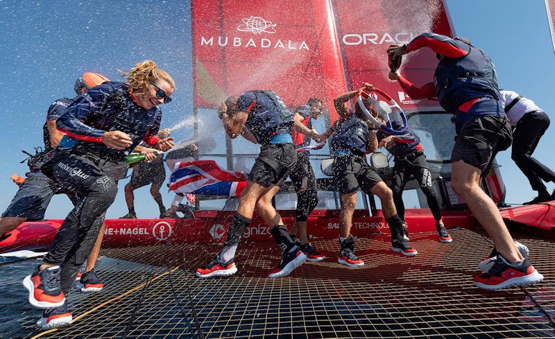 Hannah Mills, strategist of Emirates Great Britain SailGP Team, laughs as she is sprayed with Barons De Rothschild Champagne as the team celebrate winning the France Sail Grand Prix in Saint-Tropez, France photo copyright Ricardo Pinto for SailGP taken at  and featuring the F50 class