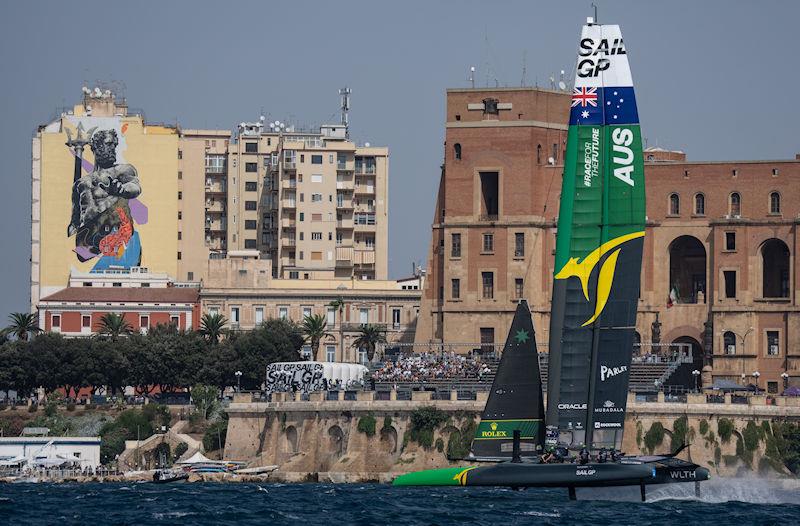 Australia SailGP Team helmed by Tom Slingsby sail past the SailGP Race Stadium in front of the Taranto Palazzo del Governo on Race Day 1 of the ROCKWOOL Italy Sail Grand Prix in Taranto, Italy - photo © Bob Martin for SailGP
