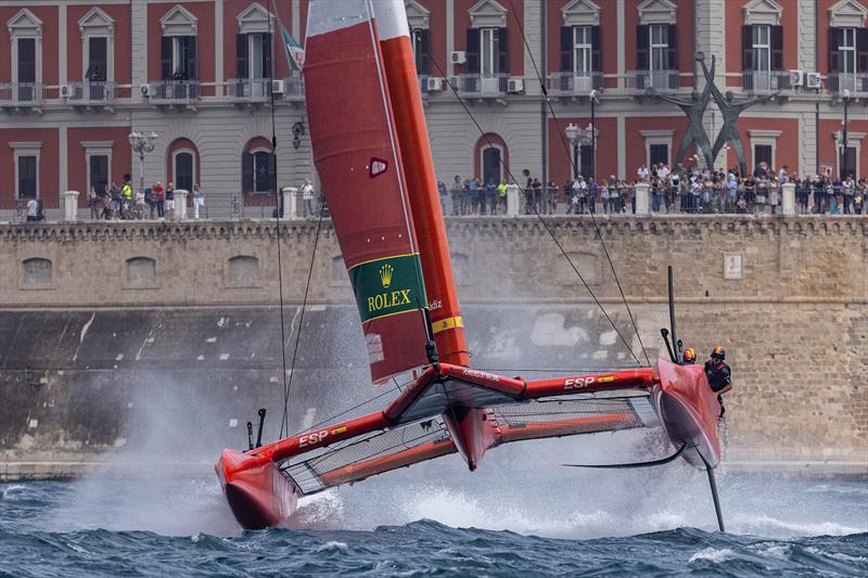 Spain SailGP Team helmed by Diego Botin undertake a manoeuvre in front of the seawall on Race Day 1 of the ROCKWOOL Italy Sail Grand Prix in Taranto, Italy - photo © Felix Diemer for SailGP