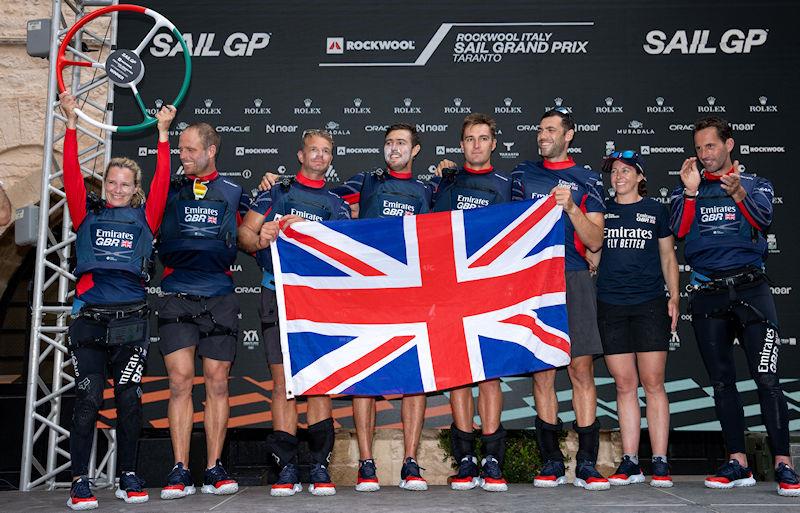 Hannah Mills, strategist of Emirates Great Britain SailGP Team, lifts the trophy in the Adrenaline Lounge after Emirates Great Britain SailGP Team win the ROCKWOOL Italy Sail Grand Prix in Taranto, Italy photo copyright Bob Martin for SailGP taken at  and featuring the F50 class