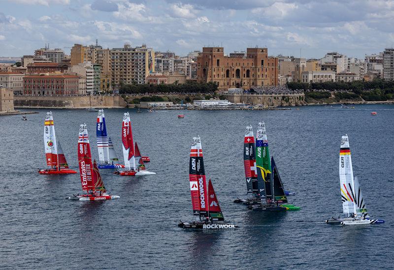 Emirates Great Britain SailGP Team helmed by Ben Ainslie lead the SailGP Fleet on Race Day 2 of the ROCKWOOL Italy Sail Grand Prix in Taranto, Italy photo copyright Felix Diemer for SailGP taken at  and featuring the F50 class