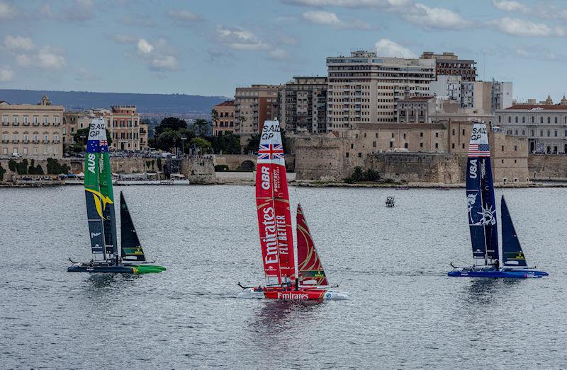 USA SailGP Team helmed by Jimmy Spithill lead Emirates Great Britain SailGP Team helmed by Ben Ainslie and Australia SailGP Team helmed by Tom Slingsby on Race Day 2 of the ROCKWOOL Italy Sail Grand Prix in Taranto, Italy photo copyright Felix Diemer for SailGP taken at  and featuring the F50 class