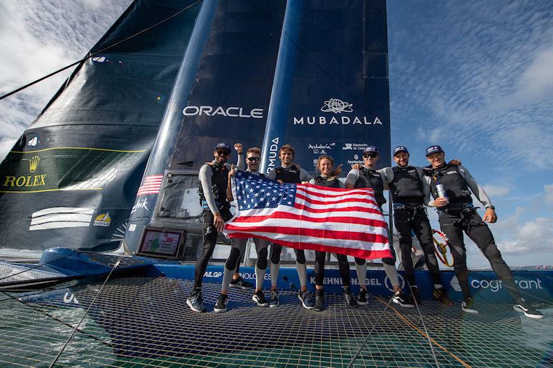 USA SailGP Team lift the USA flag as they celebrate onboard after winning the Spain Sail Grand Prix in Cadiz, Spain photo copyright Bob Martin for SailGP taken at  and featuring the F50 class