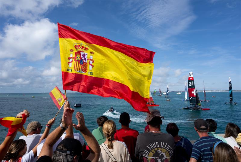 Spectators applaud the fleet as ROCKWOOL Denmark SailGP Team helmed by Nicolai Sehested crosses the finish line on Race Day 2 of the Spain Sail Grand Prix in Cadiz, Spain photo copyright Jed Leicester for SailGP taken at  and featuring the F50 class