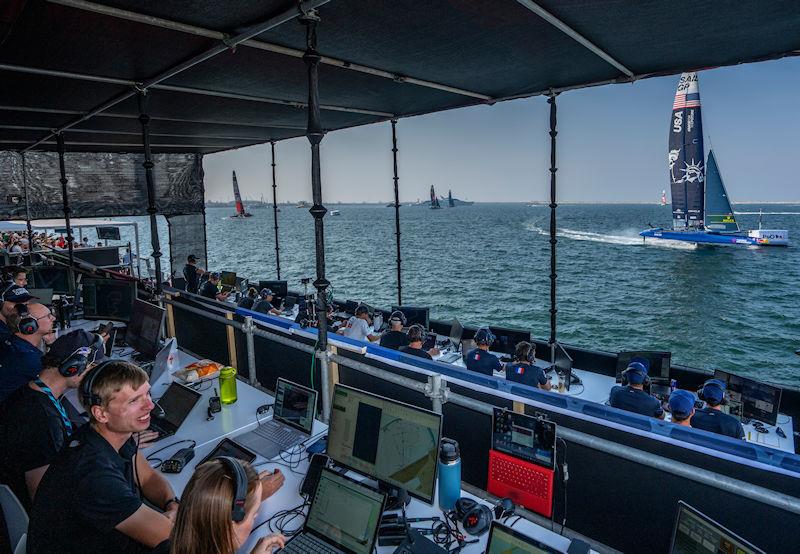 USA SailGP Team helmed by Taylor Canfield sail past the Team Coach Boxes and Race Management Platform on Race Day 1 of the Emirates Sail Grand Prix presented by P&O Marinas in Dubai, United Arab Emirates - photo © Adam Warner for SailGP