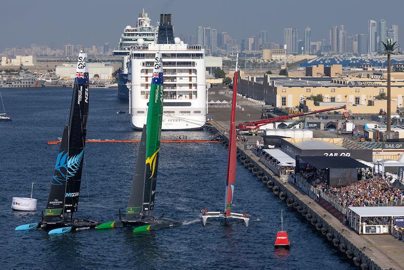 New Zealand SailGP Team leads from Australia SailGP Team and Canada SailGP Team as they cross the finish line in front of the Race Stadium in the final on Race Day 2 of the Emirates Sail Grand Prix presented by P&O Marinas in Dubai, United Arab Emirates - photo © Felix Diemer for SailGP