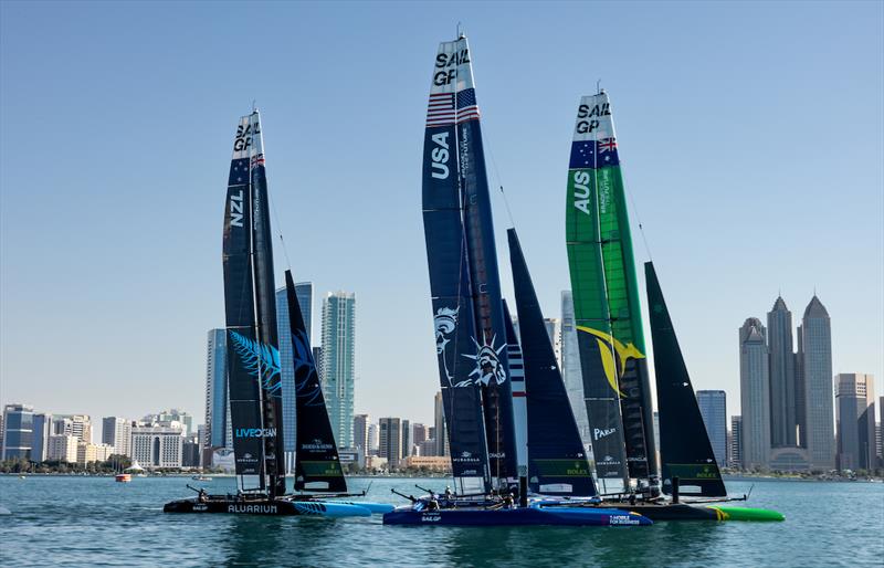 New Zealand SailGP Team, USA SailGP Team, and Australia SailGP Team sail past the Abu Dhabi skyline ahead of the Mubadala Abu Dhabi Sail Grand Prix presented by Abu Dhabi Sports Council photo copyright Felix Diemer for SailGP taken at  and featuring the F50 class