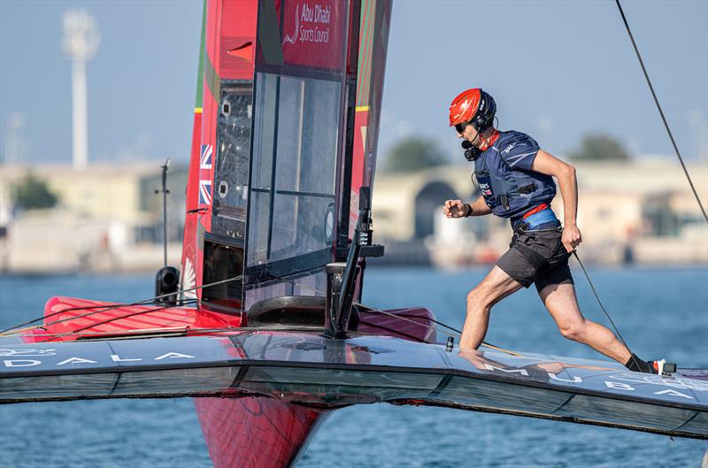 Giles Scott, driver of Emirates Great Britain SailGP Team, runs across the Emirates Great Britain SailGP Team F50 catamaran during a practice session ahead of the Mubadala Abu Dhabi Sail Grand Prix presented by Abu Dhabi Sports Council - photo © Ricardo Pinto for SailGP