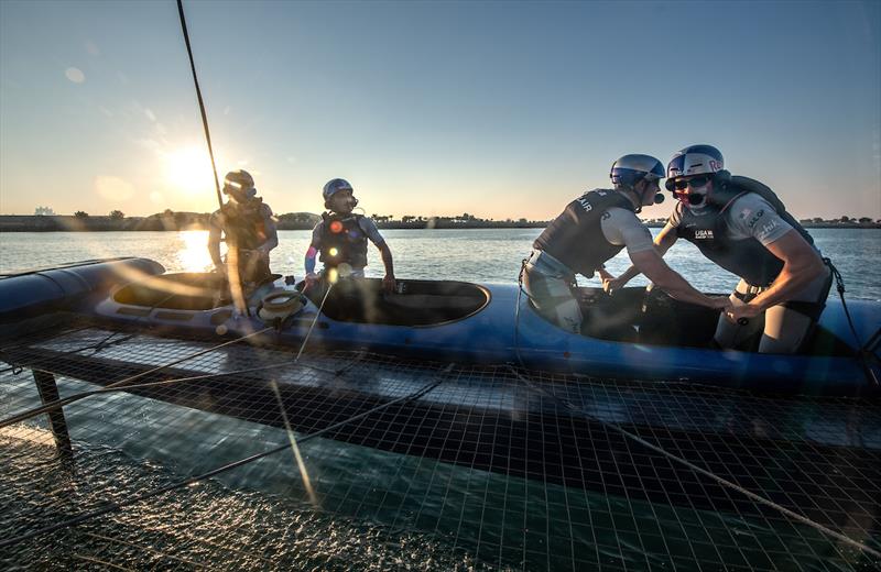 Taylor Canfield, driver of USA SailGP Team, in action behind the wheel alongside Victor Diaz de Leon, wing trimmer, controlling the ropes with Alex Sinclair, grinder, and Leo Takahashi, flight controller ahead of the Mubadala Abu Dhabi Sail Grand Prix photo copyright Ricardo Pinto for SailGP taken at  and featuring the F50 class