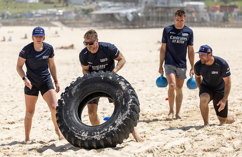 Anna Weis, strategist of USA SailGP Team, Nick Hutton, grinder of Emirates Great Britain SailGP Team, Neil Hunter, grinder of Emirates Great Britain SailGP Team, and Ben Bardwell, grinder of USA SailGP Team, take part in a Royal Australian Navy training - photo © Simon Bruty for SailGP