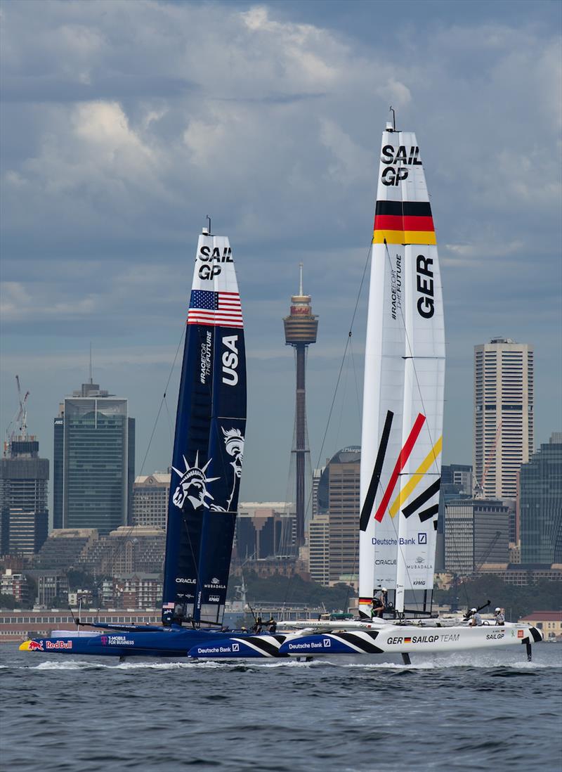 The USA SailGP Team and Germany SailGP Team F50 catamarans are towed past the Sydney skyline during a practice session ahead of the KPMG Australia Sail Grand Prix in Sydney, Australia photo copyright Ricardo Pinto for SailGP taken at  and featuring the F50 class