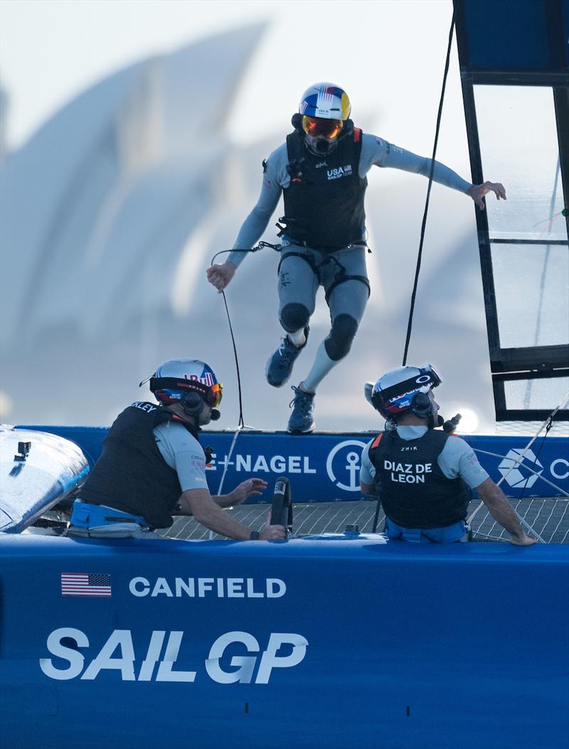 Taylor Canfield, driver of USA SailGP Team, runs across the F50 as Mike Buckley, CEO and strategist of USA SailGP Team, takes control of the wheel on Race Day 2 of the KPMG Australia Sail Grand Prix in Sydney, Australia photo copyright Ricardo Pinto for SailGP taken at  and featuring the F50 class