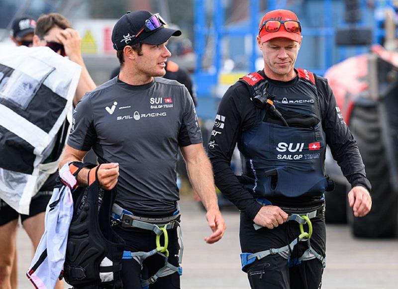 Nathan Outteridge, co-driver and sailing advisor of Switzerland SailGP Team, walks with Sebastien Schneiter, driver of Switzerland SailGP Team, after the team come off the water following a practice session ahead of the ROCKWOOL Denmark Sail Grand Prix photo copyright Ricardo Pinto for SailGP taken at  and featuring the F50 class