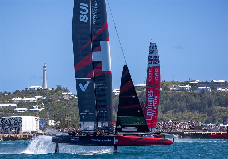 Switzerland SailGP Team helmed by Nathan Outteridge and Emirates Great Britain SailGP Team helmed by Giles Scott in action in front of the grandstand in the Race Stadium on Race Day 1 of the Apex Group Bermuda Sail Grand Prix in Bermuda photo copyright Felix Diemer for SailGP taken at  and featuring the F50 class