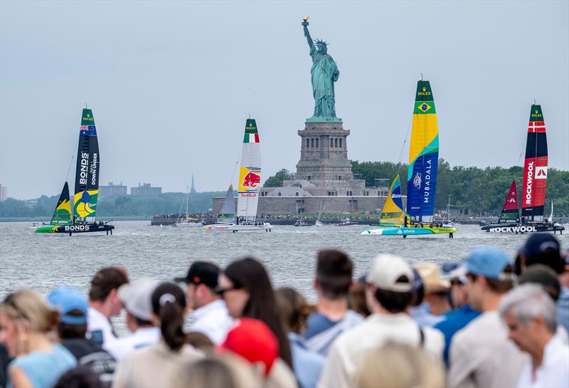 The fleet pass the Statue of Liberty - Day 2 of the Mubadala New York Sail Grand Prix  - photo © Mike Lawrence/SailGP