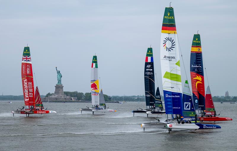 Spain SailGP Team leads Germany SailGP Team presented by Deutsche Bank, France SailGP Team, Red Bull Italy SailGP Team and Emirates Great Britain SailGP Team as they pass the Statue of Liberty on Race Day 2 of the Mubadala New York Sail Grand Prix - photo © Jason Ludlow for SailGP
