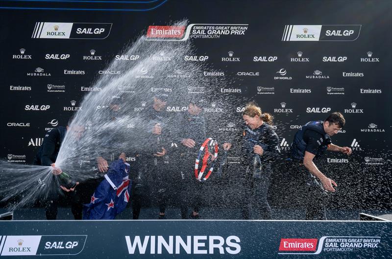 New Zealand SailGP Team spray Barons De Rothschild Champagne during the trophy presentation after winning the final race on Race Day 2 of the Emirates Great Britain Sail Grand Prix in Portsmouth, UK - photo © Andrew Baker for SailGP