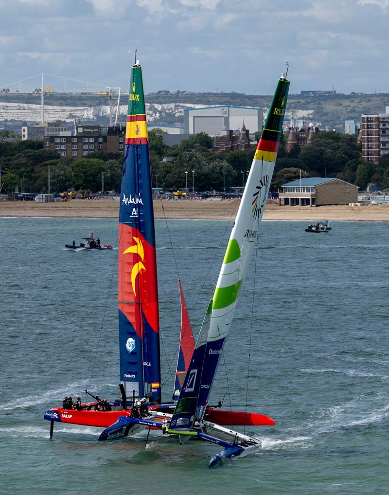 Germany SailGP Team presented by Deutsche Bank helmed by Erik Heil get alongside Spain SailGP Team helmed by Diego Botin on Race Day 2 of the Emirates Great Britain Sail Grand Prix in Portsmouth, UK - photo © Simon Bruty for SailGP