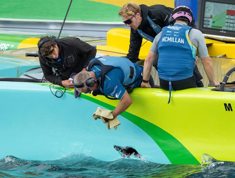 SailGP tech team repair a hole in the hull of the Mubadala Brazil SailGP Team F50 catamaran on the water, ahead of racing on Race Day 2 of the Rolex Switzerland Sail Grand Prix held in Geneva photo copyright Ricardo Pinto for SailGP taken at Lake Geneva Yacht Club and featuring the F50 class