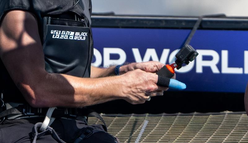 Peter Burling sailing with a blue plastic protective covering on his injured finger during Practice Racing on Friday - SailGP Grand Final - Abu Dhabi - November 28, 2025  - photo © Ricardo Pinto/SailGP