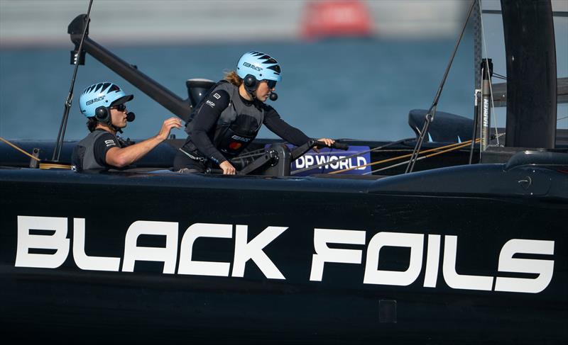 Black Foils' Strategist Liv Mackay  back on the grinders during Practice Racing on Friday - SailGP Grand Final - Abu Dhabi - November 28, 2025  - photo © Ricardo Pinto/SailGP