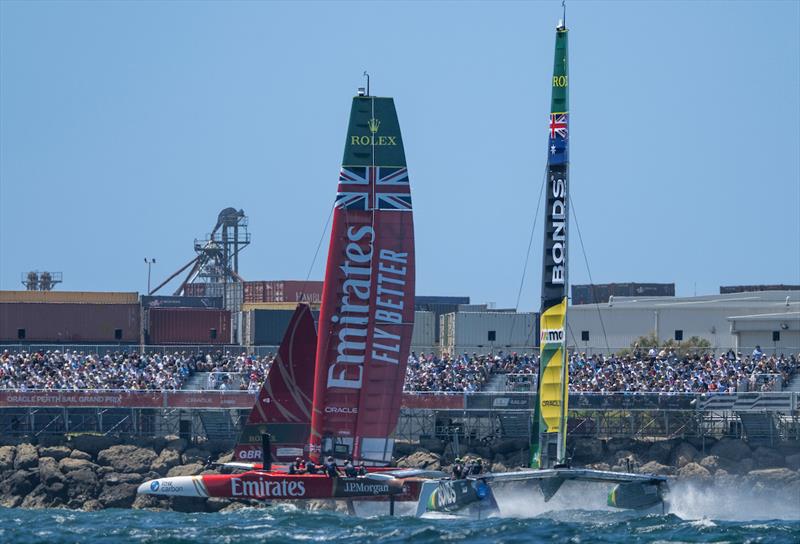 Emirates Great Britain SailGP Team helmed by Dylan Fletcher leading BONDS Flying Roos SailGP Team helmed by Tom Slingsby as they sail past Spectators watching from Grandstand in the Race Stadium, on Race Day 2 of the Oracle Perth Sail Grand Prix - photo © Ricardo Pinto for SailGP