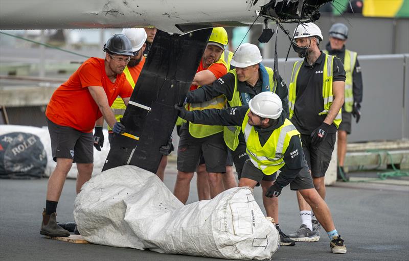 Members of the SailGP shore team works on the wreckage of the DS Automobiles SailGP Team France F50 catamaran on Race Day 1 of the ITM New Zealand Sail Grand Prix in Auckland, New Zealand photo copyright James Gourley for SailGP taken at  and featuring the F50 class