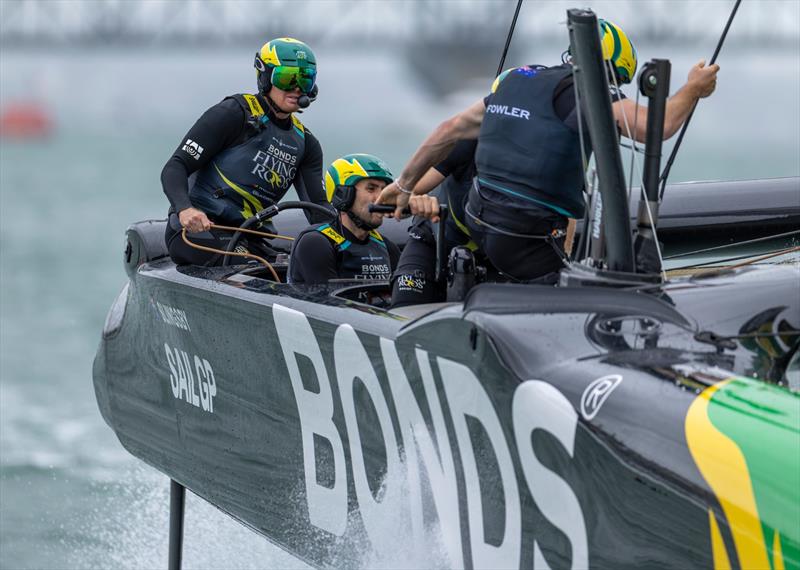 Tom Slingsby, driver of BONDS Flying Roos SailGP Team, controls the wheel of the F50 catamaran whilst in action on Race Day 1 of the ITM New Zealand Sail Grand Prix in Auckland, New Zealand - photo © Felix Diemer for SailGP