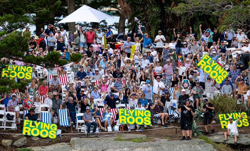 Spectators holding signs in support of the BONDS Flying Roos SailGP Team watch the racing from Shark Island on Race Day 2 of the KPMG Australia Sail Grand Prix in Sydney, Australia - photo © Simon Bruty for SailGP