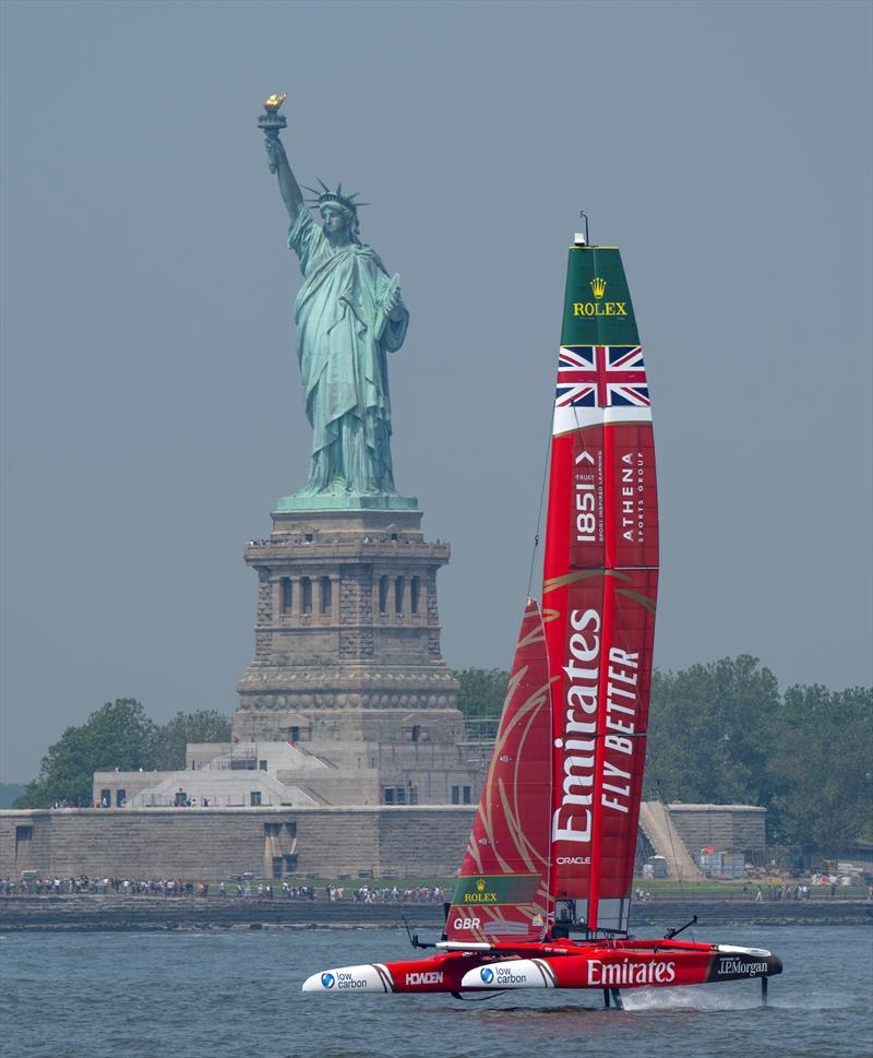 Emirates Great Britain SailGP Team helmed by Dylan Fletcher in action as they pass the Statue of Liberty during a practice session ahead of the Mubadala New York Sail Grand Prix in New York, USA - photo © Jason Ludlow for SailGP