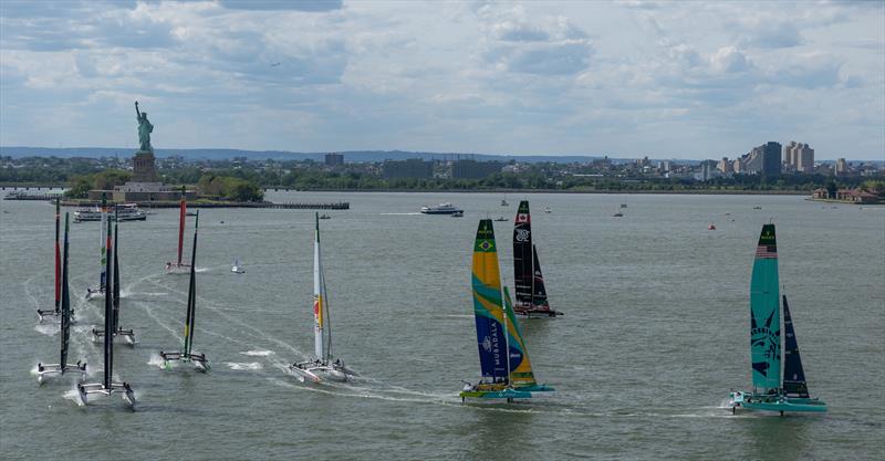 The SailGP F50 catamaran fleet in action by the Statue of Liberty on Race Day 2 of the Mubadala New York Sail Grand Prix - photo © Simon Bruty for SailGP