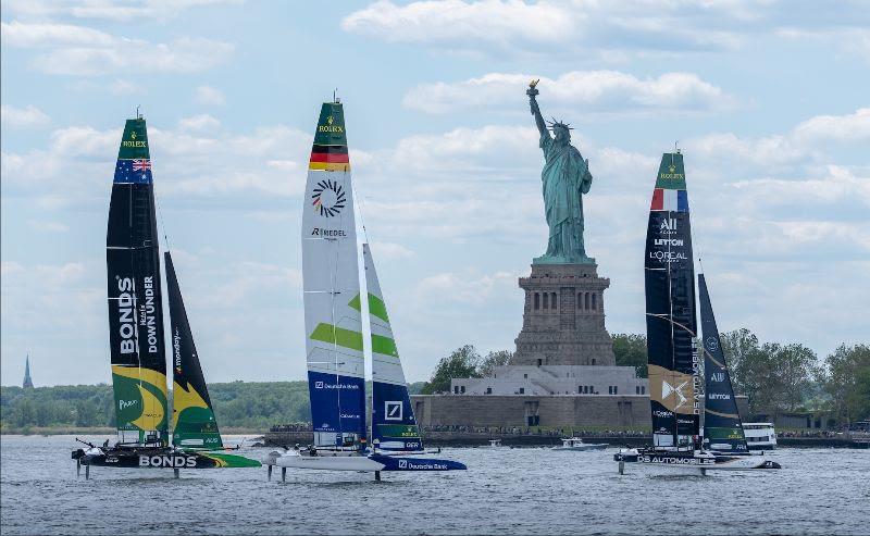 The SailGP F50 catamaran fleet in action by the Statue of Liberty on Race Day 2 of the Mubadala New York Sail Grand Prix photo copyright Jason Ludlow for SailGP taken at  and featuring the F50 class