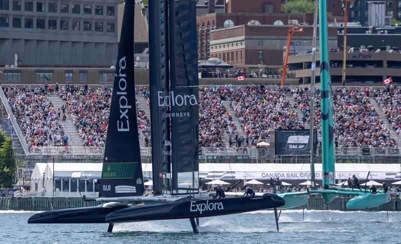 Explora Journeys Swiss SailGP Team driven by Sebastien Schneiter ahead of United States SailGP Team in front of the grandstand on Race Day 2 of the Canada Sail Grand Prix in Halifax, Canada photo copyright Samo Vidic for SailGP taken at  and featuring the F50 class