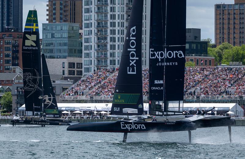 Explora Journeys Swiss SailGP Team driven by Sebastien Schneiter leads Artemis SailGP Team driven by Nathan Outteridge in front of the Grandstand on Race Day 2 of the Canada Sail Grand Prix in Halifax, Canada photo copyright Samo Vidic for SailGP taken at  and featuring the F50 class