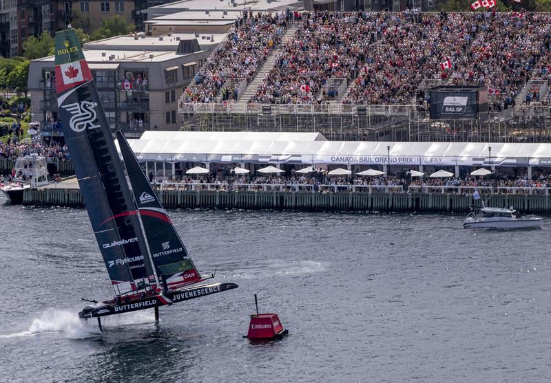 NORTHSTAR SailGP Team driven by Giles Scott crosses the finish line in front of the grandstand on Race Day 2 of the Canada Sail Grand Prix in Halifax, Canada photo copyright Jonathan Nackstrand for SailGP taken at  and featuring the F50 class