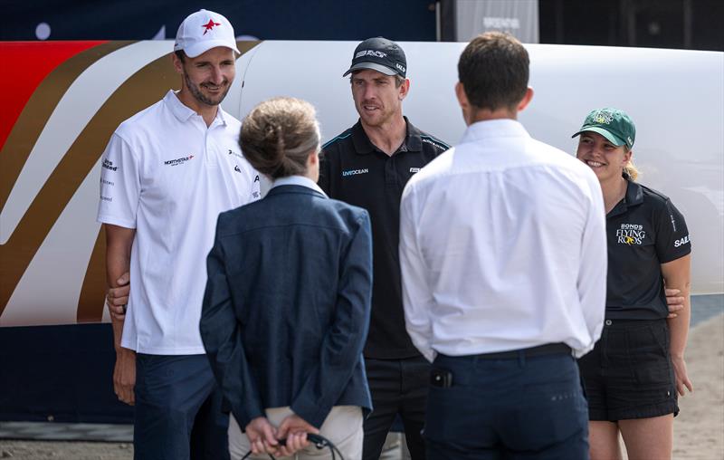 HRH The Princess Royal speaks with Giles Scott, driver of  SailGP Team, Peter Burling, co-CEO and driver of Black Foils SailGP Team, and Tash Bryant, strategist of Bonds Flying Roos, Emirates Great Britain Sail Grand Prix, Portsmouth, July 2026 - photo © Felix Diemer/SailGP