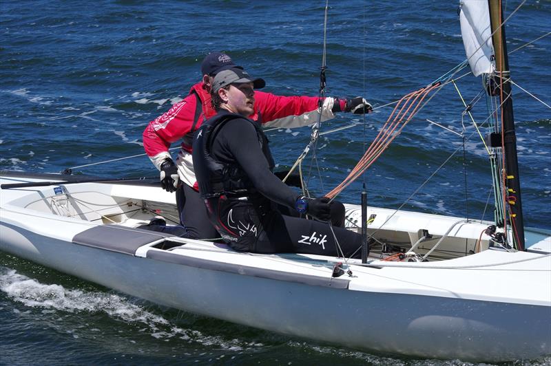 Five races down and one to go, the exhaustion shows on the faces of David Ham and Finn Buckley of Green Eggs and Ham AUS32 as they cross the finish line in the Flying Dutchman 2026 Australian championship regatta. They retired at the end of this race - photo © Jeanette Severs