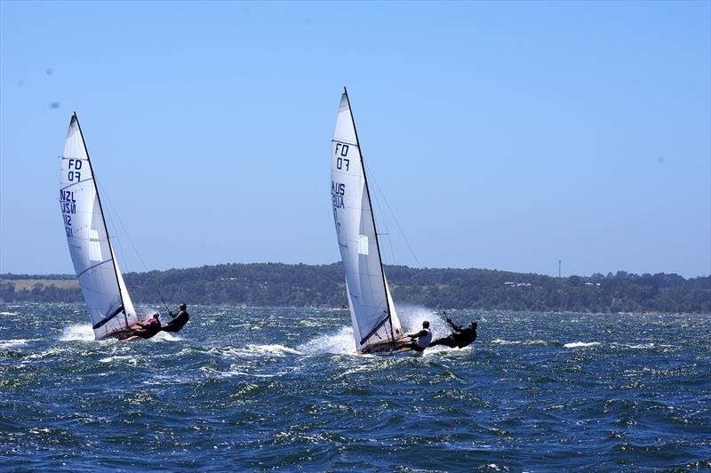 David Gibb and John Bailey on Lupicus NZL112 and Rafe Heale and Tom Watson on Power AUS7 sprint away from the start line in race six, for the Flying Dutchman 2026 Australian championship, held at Metung, Victoria, Australia photo copyright Jeanette Severs taken at Metung Yacht Club and featuring the Flying Dutchman class