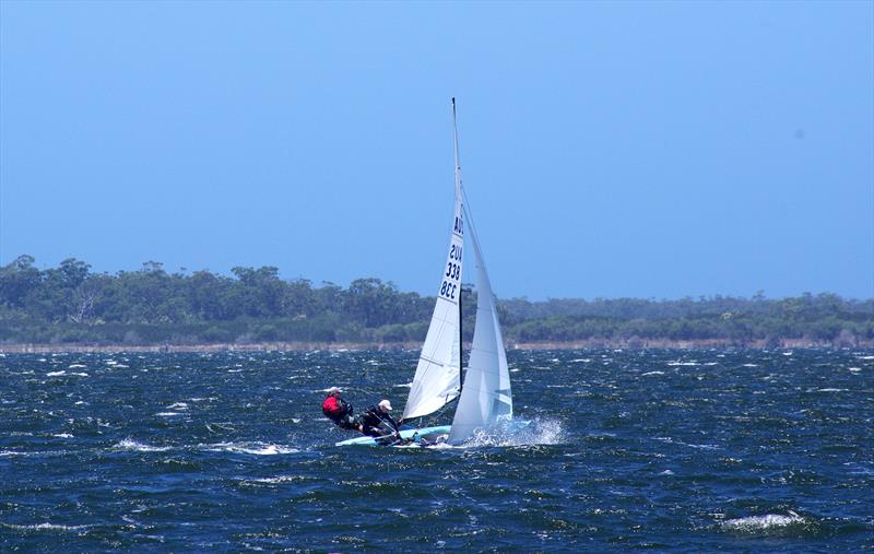 Gary Cameron and Darren Hocking in Blu Tak AUS338 was the third boat around the leeward mark in race six, and kicked up water as they sailed toward the windward gates; for the Flying Dutchman 2026 Australian championship, held at Metung, Australia - photo © Jeanette Severs