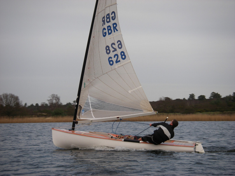 Nick Craig near the finish line to take the New Year Salver trophy at Frensham Pond photo copyright Jim Morley taken at Frensham Pond Sailing Club and featuring the Finn class