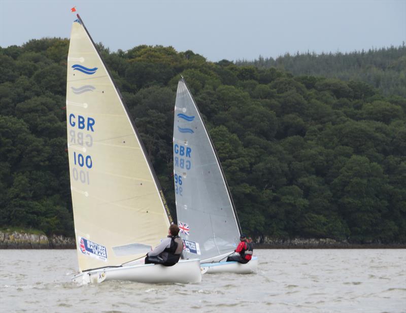 Two Finn class dinghies in close company; Mark Crowther leads Stewart Mitchell during the Catherinefield Windows RNLI Regatta in Kippford photo copyright John Sproat taken at Solway Yacht Club and featuring the Finn class