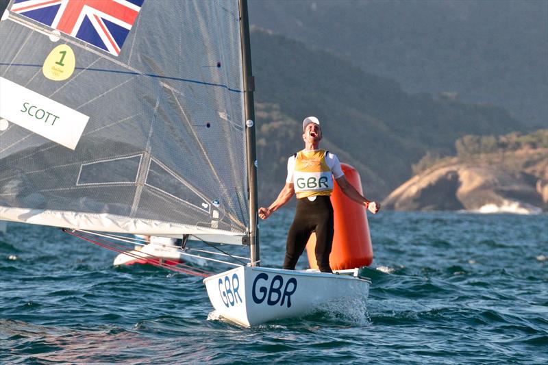Giles Scott (GBR) celebrates winning the Finn Gold Medal at the 2016 Olympics - one day ahead of the Medal race for the class photo copyright Richard Gladwell taken at  and featuring the Finn class