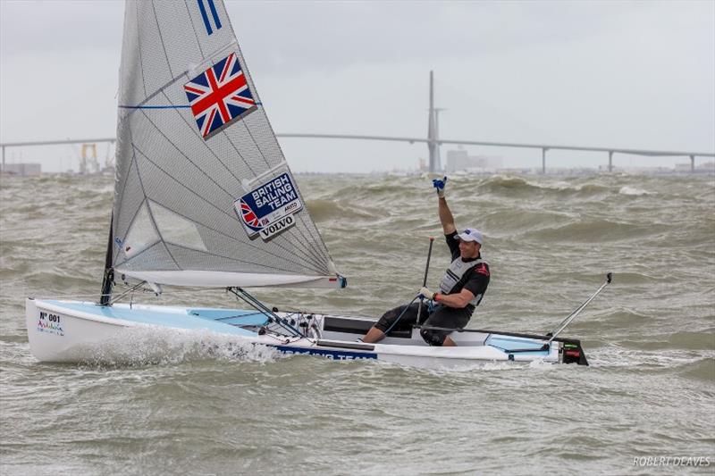 Ed Wright celebrates after the Medal Race photo copyright Robert Deaves taken at  and featuring the Finn class