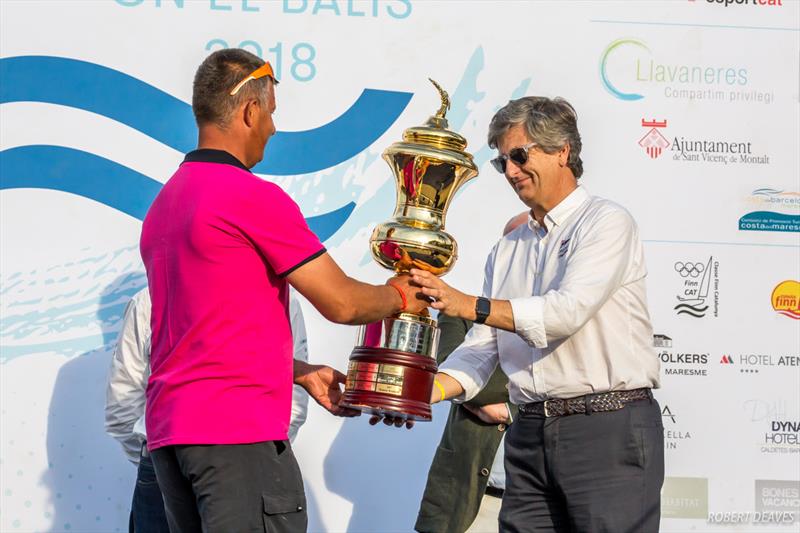 Last year's winner Vladimir Krutskikh presents the trophy to Sr. Ripoll - 2018 Finn World Masters - photo © Robert Deaves