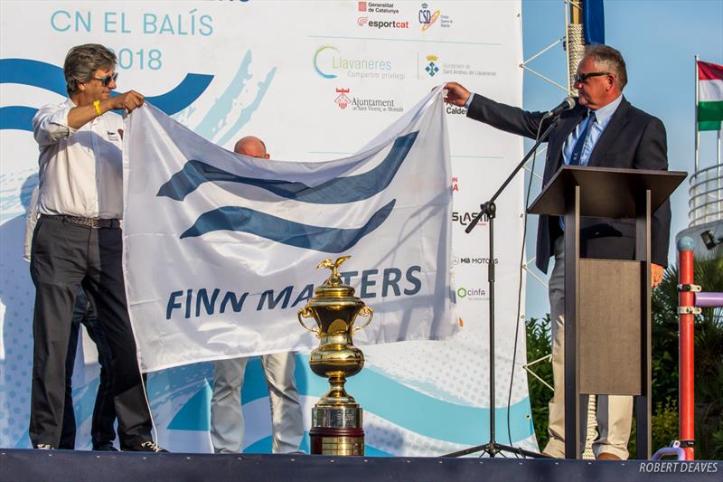 The President of the Club Náutic El Balís, Fran Ripoli, receives the Finn Masters flag from the Finnn Masters President, Andy Denison - 2018 Finn World Masters photo copyright Robert Deaves taken at  and featuring the Finn class