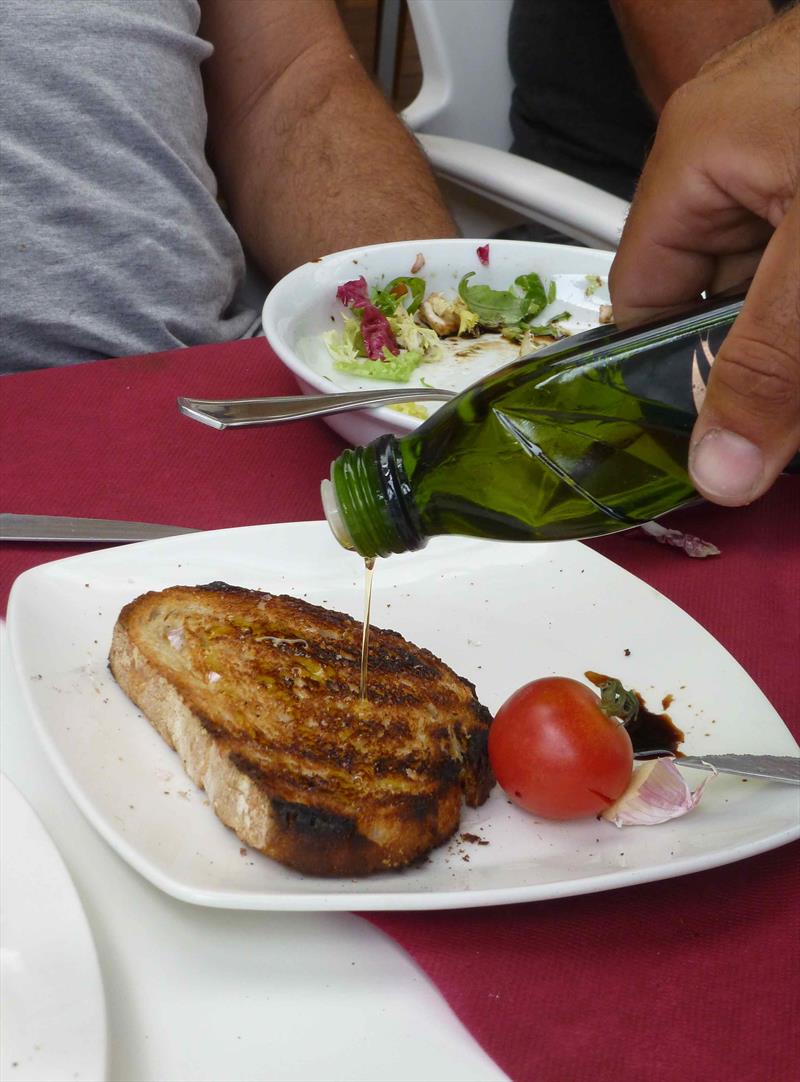 Toast, garlic, olive oil and tomato - Final Day Finn World Masters, El Balis - May 2018 photo copyright Gus Miller taken at Club Nautico El Balis and featuring the Finn class